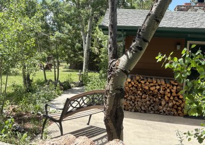 Peaceful outdoor seating area with mountain views at Travel Magick Spiritual Retreat Center Colorado